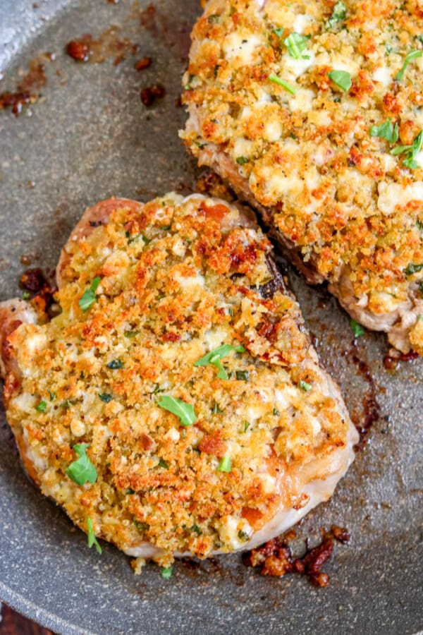 crusted pork chops in a skillet