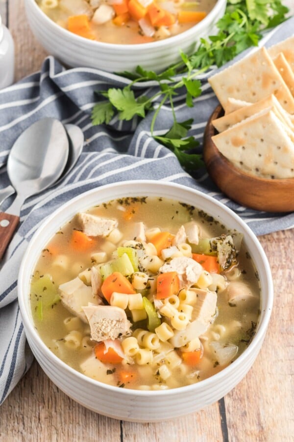 chicken noodle soup in a white bowl