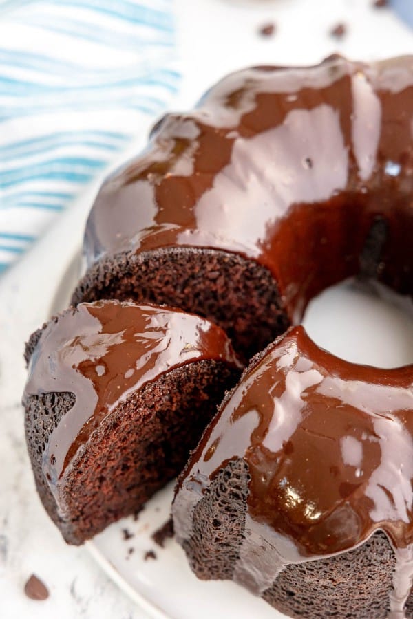 chocolate bundt cake with a slice taken out.