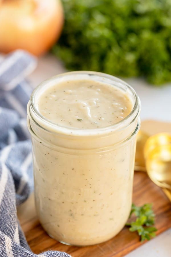 homemade cream of chicken soup in a jar on a wooden board