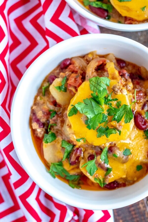 A close up of a plate of cowboy casserole in a white bowl