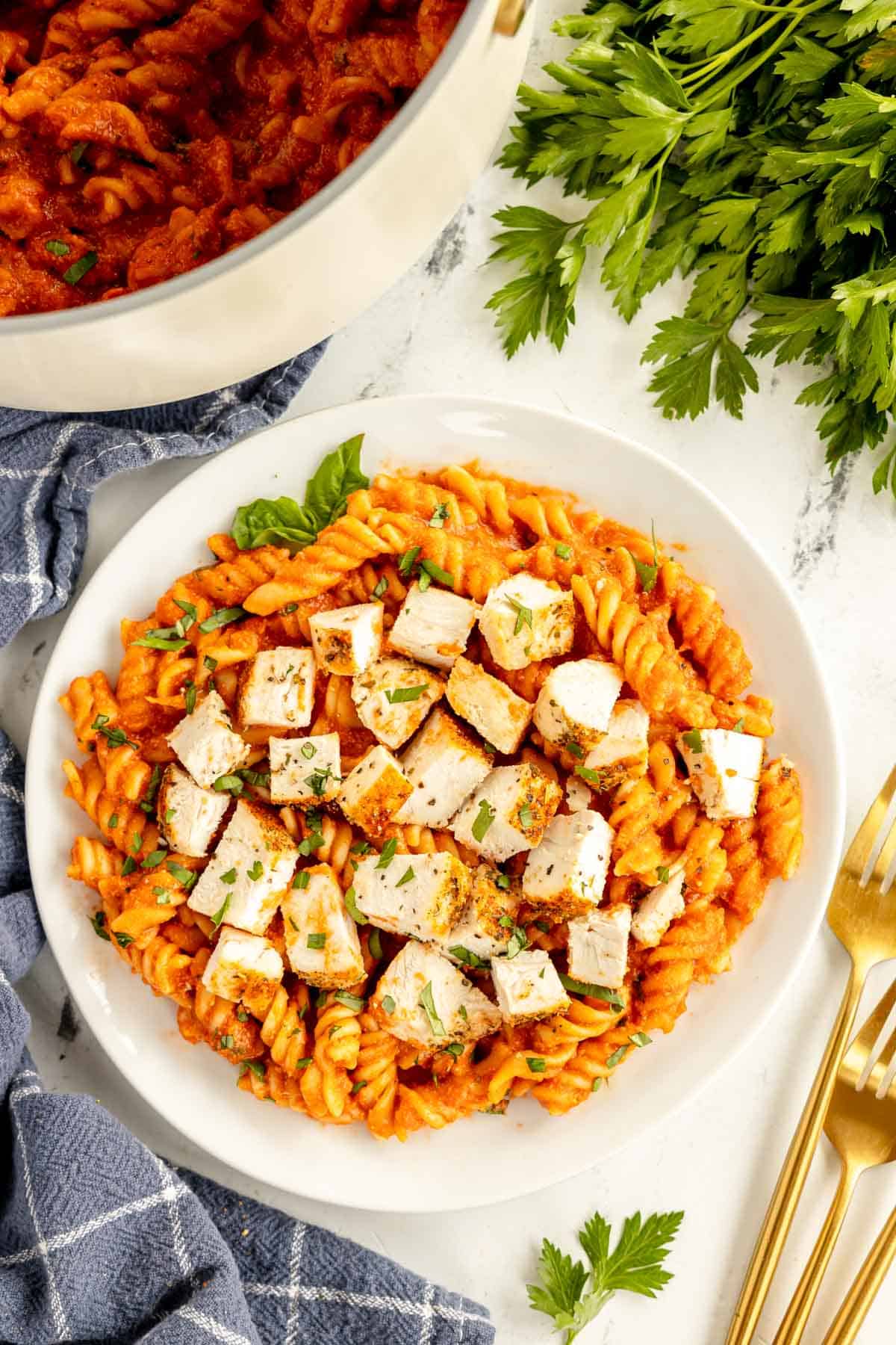 tomato chicken pasta in a bowl.