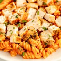 tomato chicken pasta in a bowl.