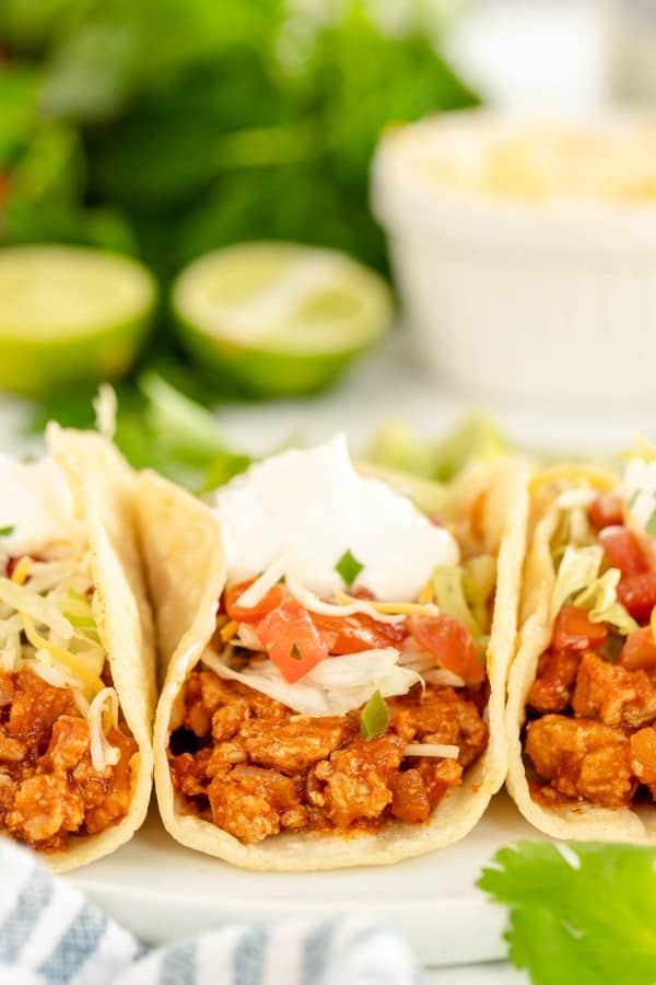 3 turkey tacos on a plate.