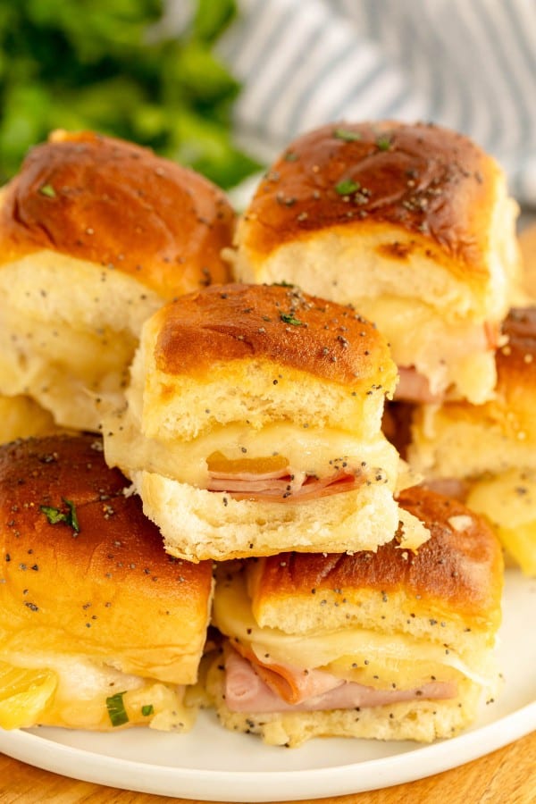 plate with hawaiian sliders stacked on it.