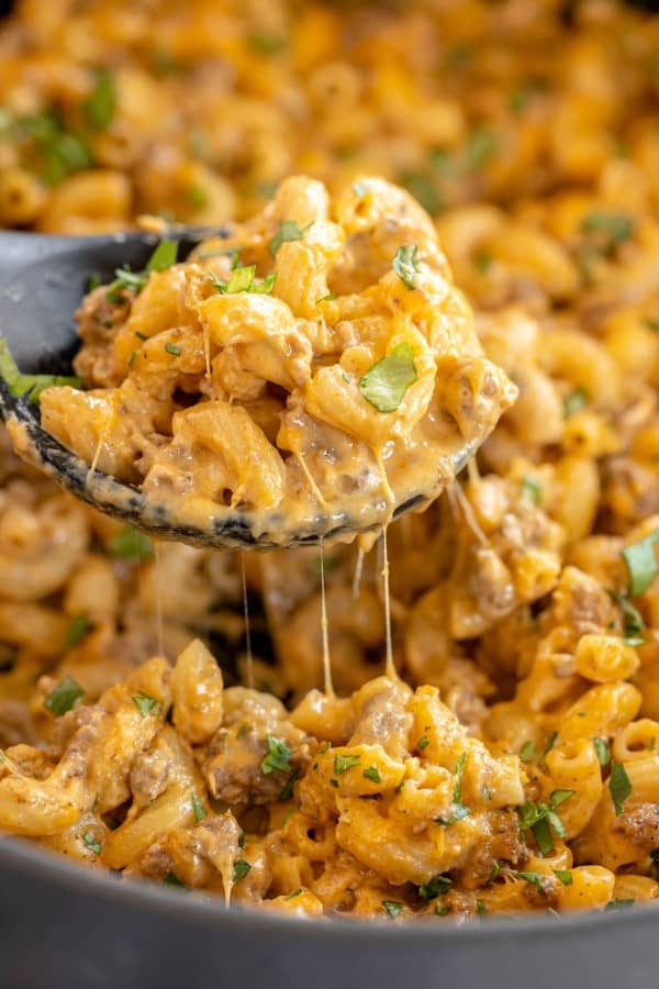 cheeseburger pasta close up on a ladle.