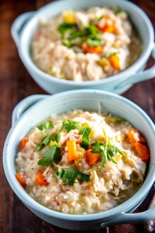 instant pot chicken and rice in two teal bowls