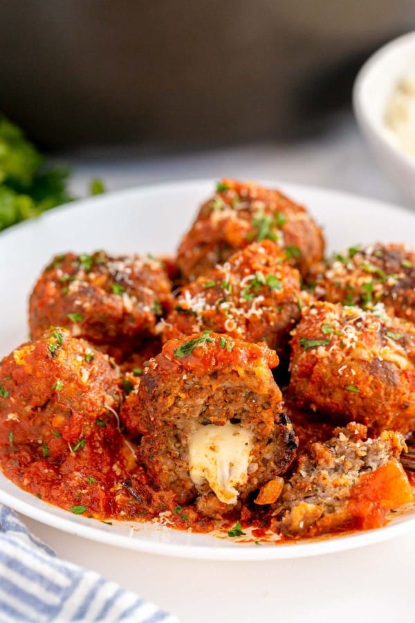 cheese stuffed meatballs on a white plate