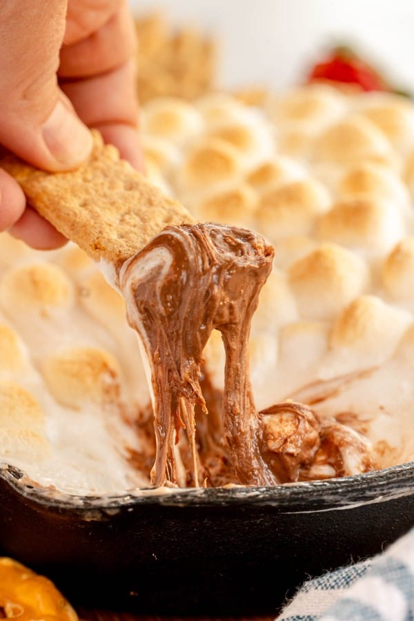 smores dip on a graham cracker.